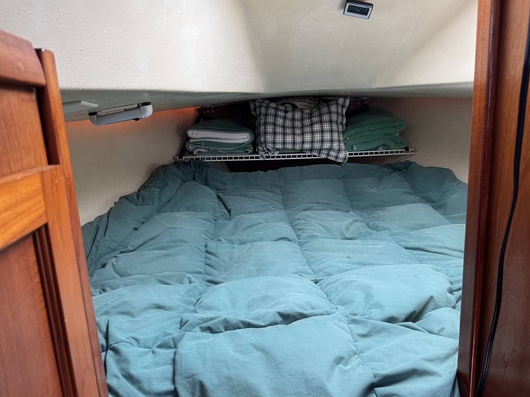 Forward cabin made up as a double berth, seen through the doorway